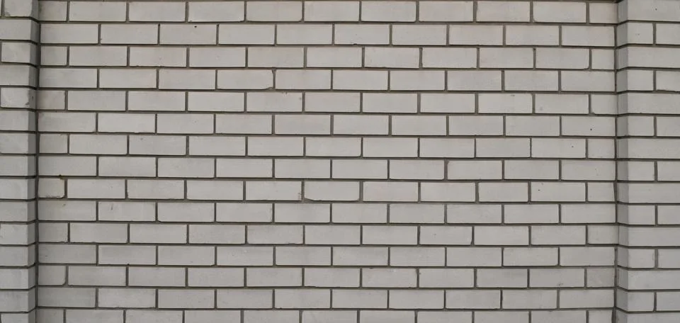 Brick wall with uniform pattern creates structured abstract background with.. Fotos de archivo
