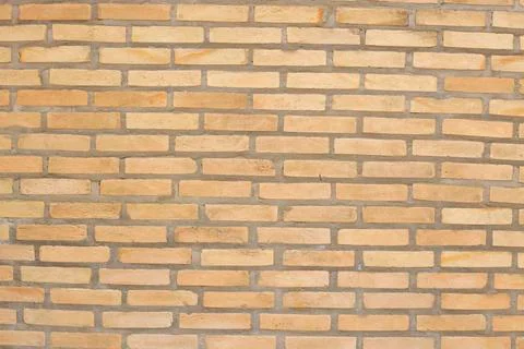 Brick wall in view for backgrounds and textures Stock Photos