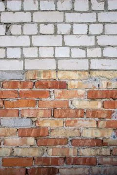 Brick wall of white and red bricks, texture and background, building houses Stock Photos