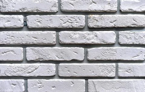 Brick wall of white bricks. Background and texture of brickwork. Stock Photos