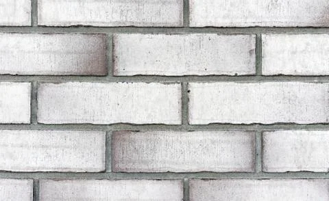 Brick wall from of white bricks. Background and texture of brickwork. Stock Photos