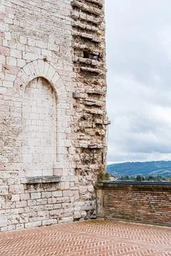 A brick wall with a window and a balcony in Gubbio Italy Umbria Stock Photos