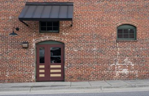 Brick wall with window door Stock Photos