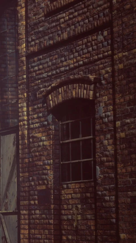Brick wall with window in an old building during the day Stock Footage 335975513