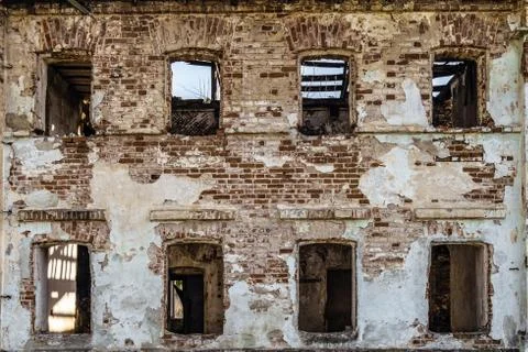 Brick wall with window openings of old abandoned historical building Stock Photos