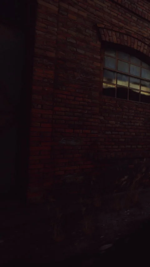 Brick wall with window at sunset in an industrial area Stock Footage 343156444