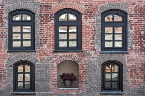 Brick wall with windows. Stock Photos