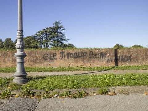 Brick wall with writings on it Stock Photos