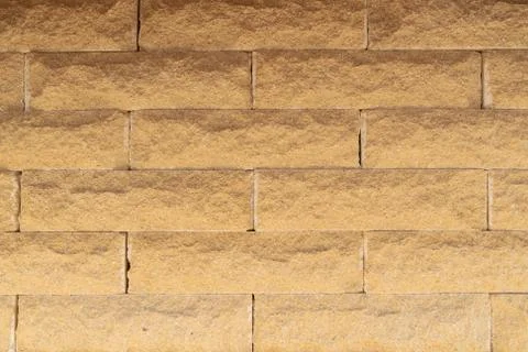 Brick wall of yellow brick. Creative vintage background. Stock Photos