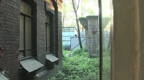 Brick walls running yard view from the window Stock Footage 5164909