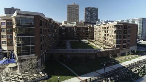 Brick wings enclosing a raised courtyard in West New York 库存影片 87958747