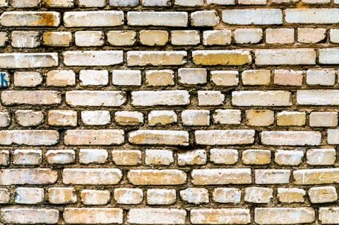 Brick yellow wall backgraund Фото