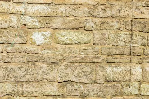 Brick yellow wall texture background Stock Photos
