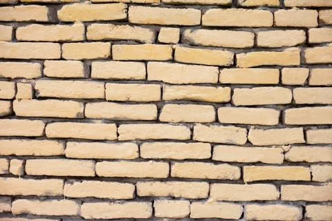 Bricked yellow wall Foto stock