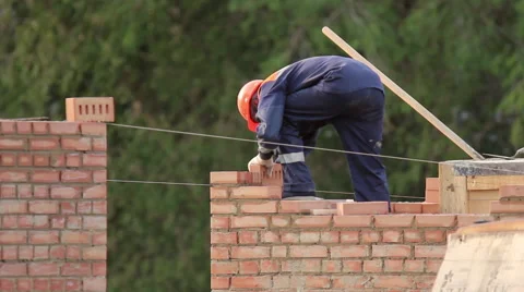 The bricklayer building a brick wall Stock Footage 64277305