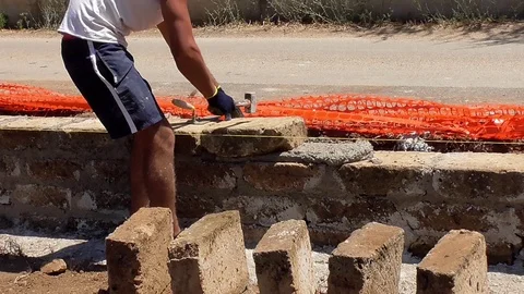 Bricklayer building a wall Stock Footage 97176207