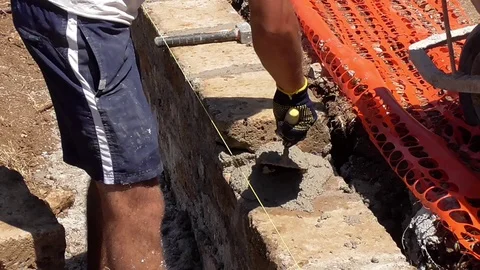 Bricklayer building a wall Stock Footage 97176455