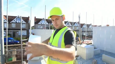Bricklayer on construction site Stock Footage 12150924