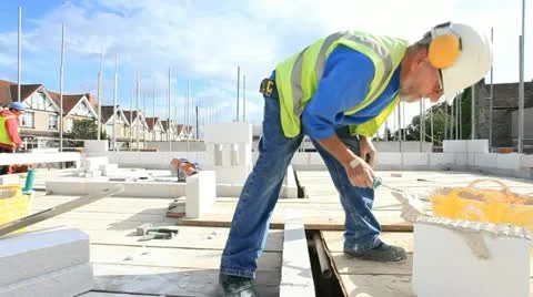Bricklayer on construction site Stock Footage 12183946