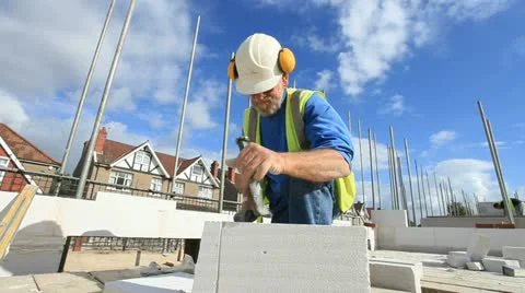 Bricklayer on construction site Stock Footage 12184317