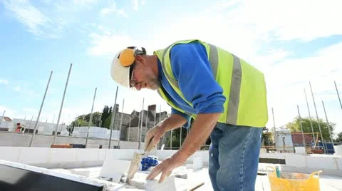 Bricklayer on construction site Stock Footage 12185033
