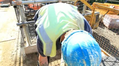 Bricklayer on construction site Stock Footage 12185898