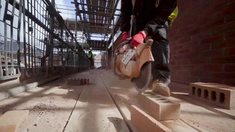 Bricklayer Cuts Bricks With Diesel Circle Saw Stock Footage 239754739