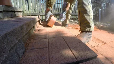 Bricklayer grinder sawing brick. 4K. Stock Footage 100609211