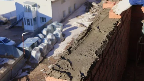 Bricklayer Hard at Work Ongoing Construction of a Residential Building Structure Stock Footage 305850316