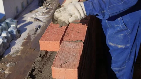 Bricklayer Hard at Work Ongoing Construction of a Residential Building Structure Stock Footage 305850378