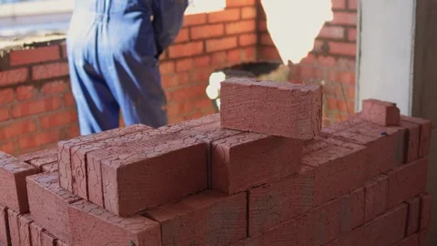 Bricklayer Hard at Work Ongoing Construction of a Residential Building Structure Stock Footage 305850616