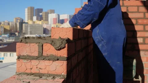 Bricklayer Hard at Work Ongoing Construction of a Residential Building Structure Stock Footage 305850685