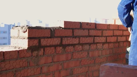 Bricklayer Hard at Work Ongoing Construction of a Residential Building Structure Stock Footage 305850694