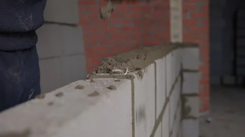 Bricklayer Hard at Work Ongoing Construction of a Residential Building Structure Stock Footage 308036595