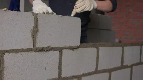Bricklayer Hard at Work Ongoing Construction of a Residential Building Structure Stock Footage 308036747