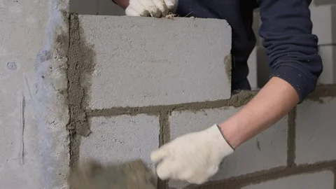 Bricklayer Hard at Work Ongoing Construction of a Residential Building Structure Stock Footage 308036759