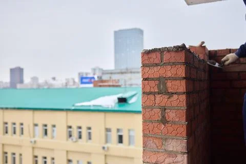Bricklayer Hard at Work Ongoing Construction of a Residential Building Structure Stock Photos