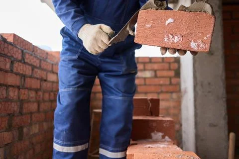 Bricklayer Hard at Work Ongoing Construction of a Residential Building Structure Stock Photos