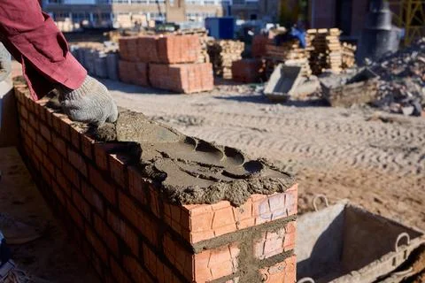 Bricklayer Hard at Work Ongoing Construction of a Residential Building Structure Stock Photos