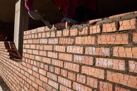 Bricklayer Hard at Work Ongoing Construction of a Residential Building Structure Stock Photos