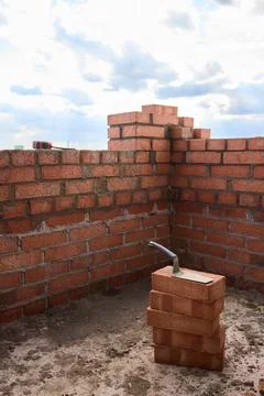 Bricklayer Hard at Work Ongoing Construction of a Residential Building Structure Stock Photos