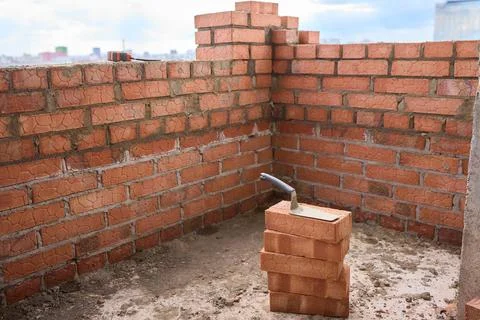 Bricklayer Hard at Work Ongoing Construction of a Residential Building Structure Stock Photos