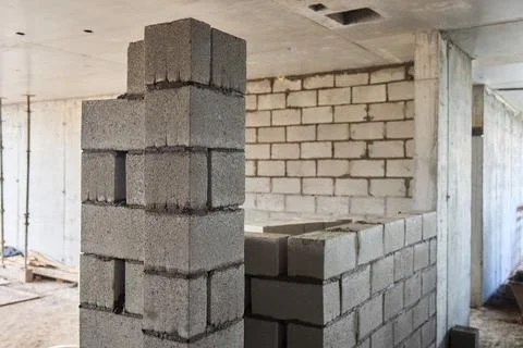 Bricklayer Hard at Work Ongoing Construction of a Residential Building Structure Stock Photos