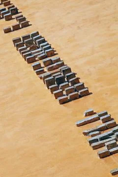 Bricklayer installing bricks on construction site Stock Photos