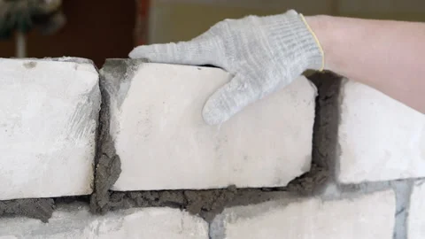 A bricklayer is laying bricks. Stock Footage 239655020