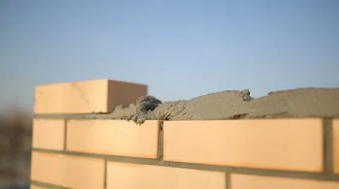 Bricklayer laying bricks to make a wall 4 Stock-Footage 63170560