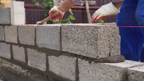 Bricklayer laying out a brick wall Stock Footage 315178475