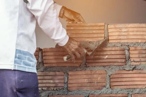 Bricklayer man working build for construction Stock Photos