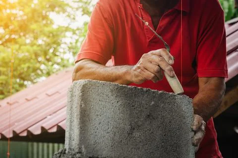 Bricklayer man working build for construction at home Stock Photos
