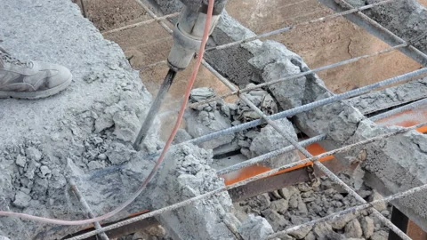 Bricklayer man working with jackhammer on construction site,job equipment tools Stock Footage 160507965
